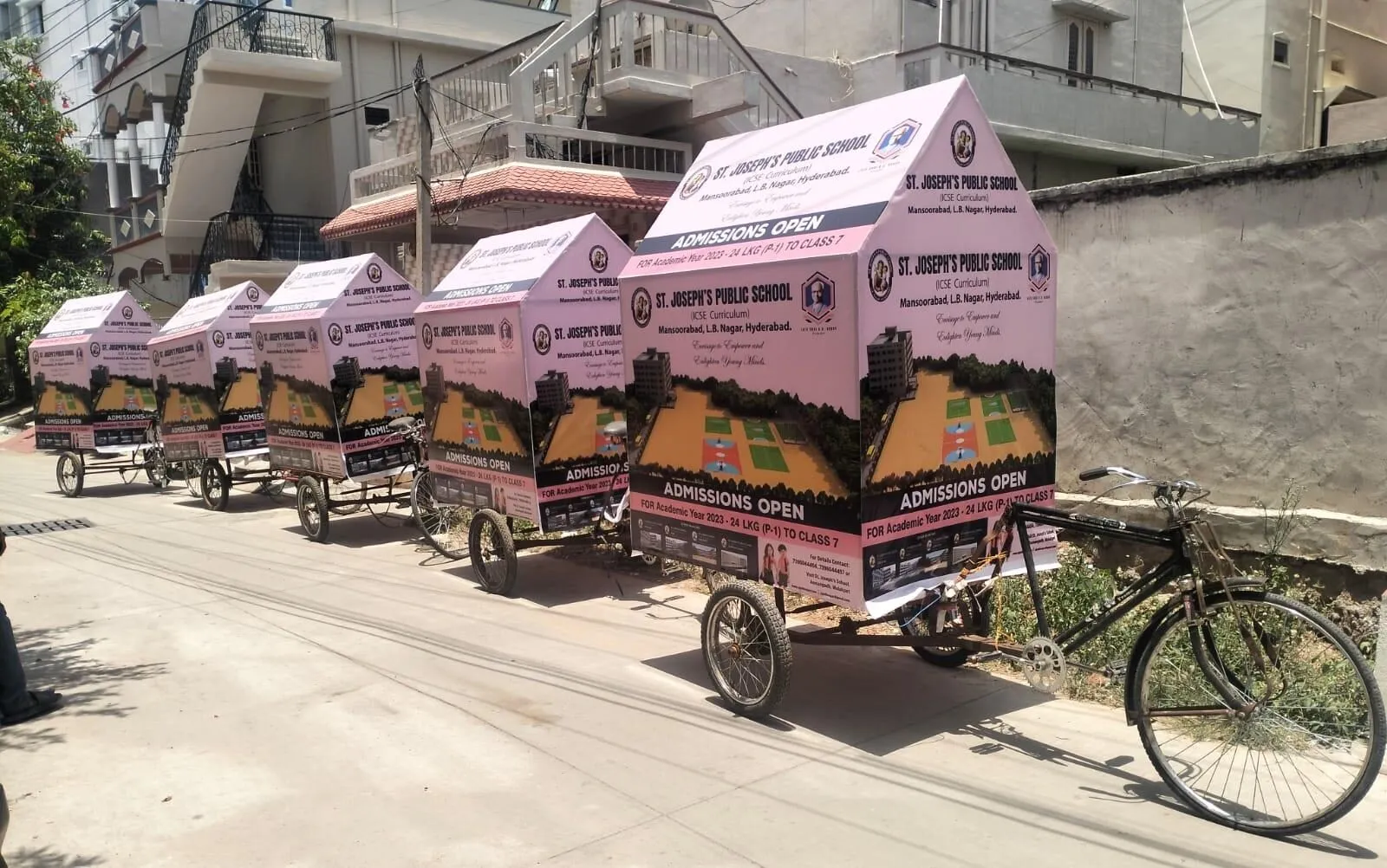 Fleet of branded tricycle carts for a school admissions campaign